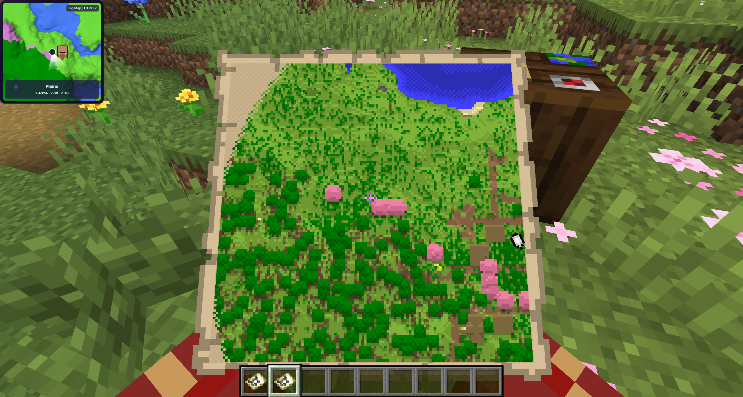 A partially explored small map held by a Minecraft player